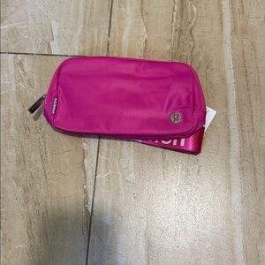 lululemon athletica pink beltbag 1L price tag removed, description tag attached
